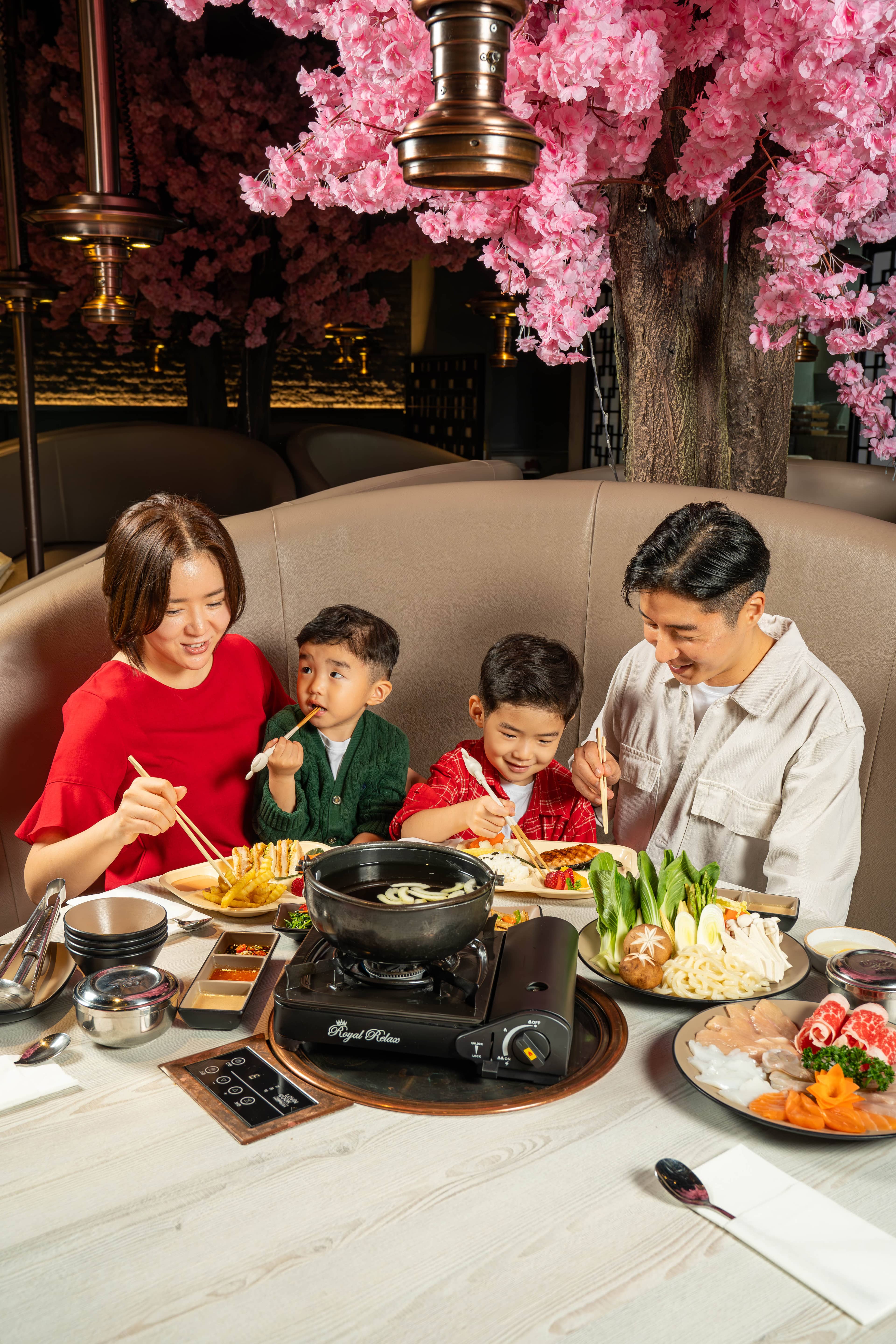 A family sharing a hotpot dinner at Yee Hwa