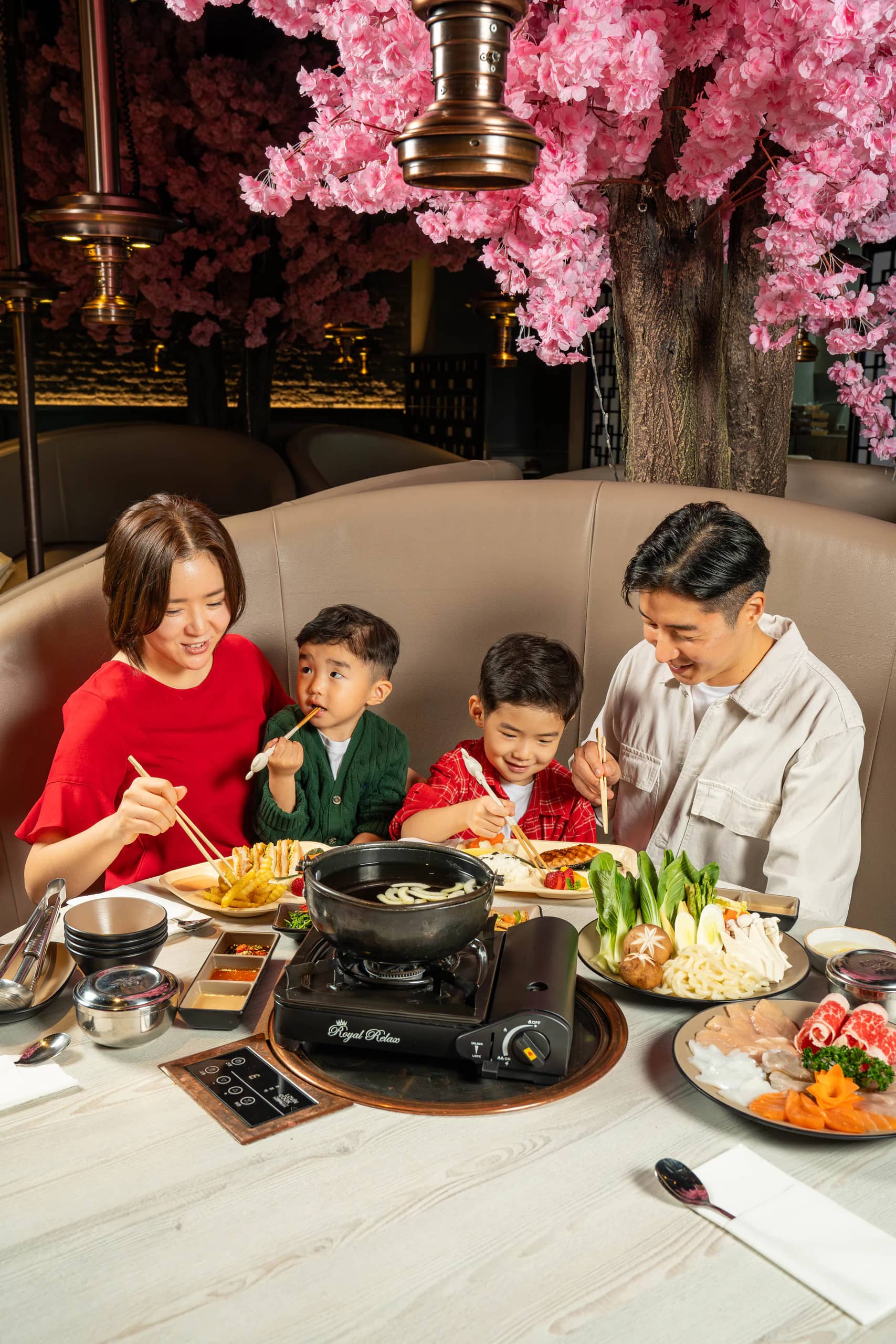 A family sharing a hotpot dinner at Yee Hwa